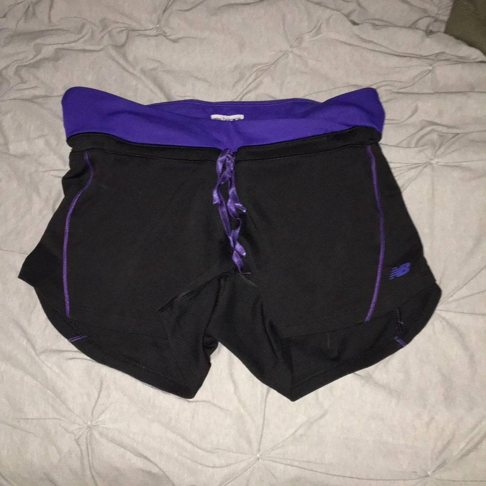 Black & purple New Balance spandex shorts.